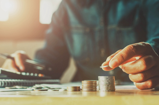 hand stacking coins investment savings