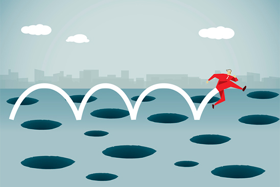 The illustration shows a businessperson jumping to avoid a series of holes which represent investor traps.